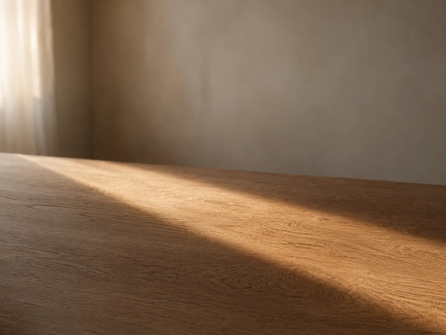 Light moving slowly across an empty wooden table over the course of an afternoon.